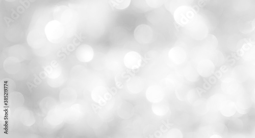 A brilliant white background with circles and ovals. Template for a holiday card with bright and sparkling lights.