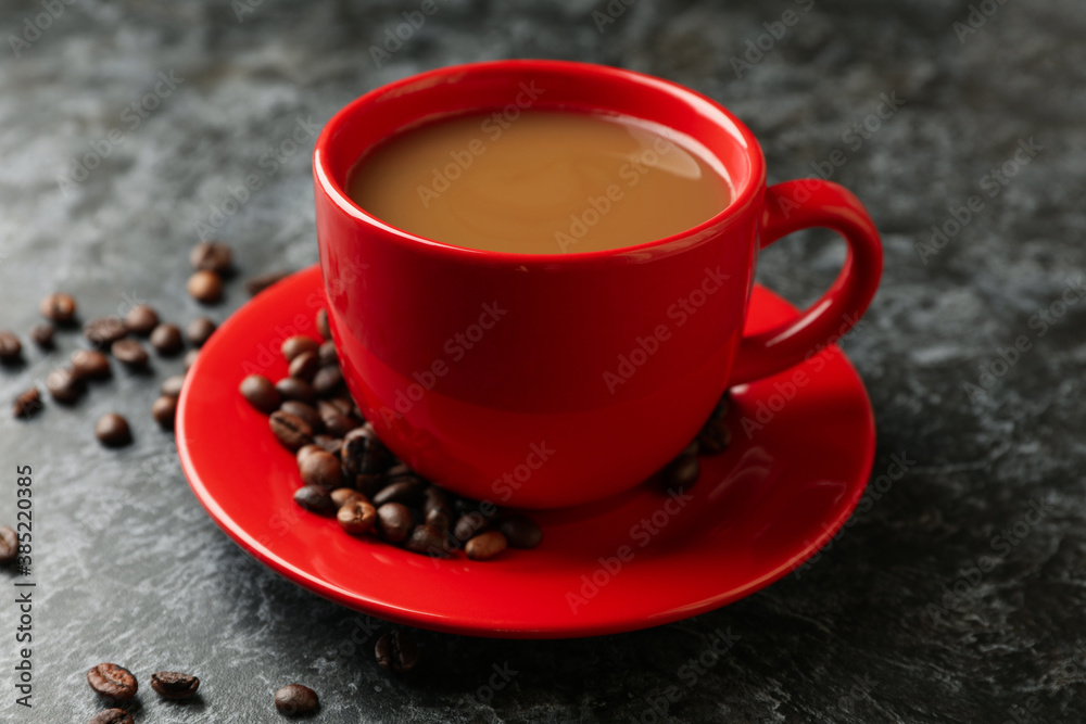 Red cup of coffee on black smoky background Red cup of coffee on black smoky background