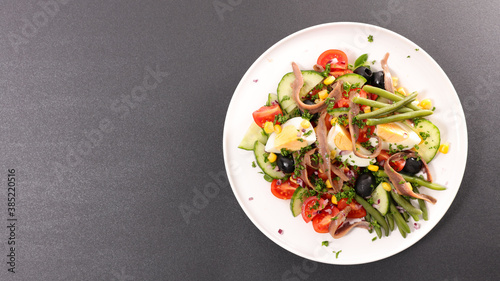 vegetable salad with egg, cucumber, tomato and anchovy