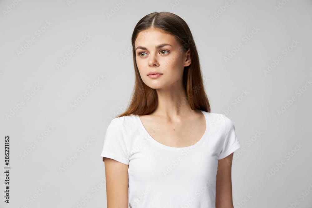 Woman in white cropped t-shirt lifestyle looks to the side Woman in white cropped t-shirt lifestyle looks to the side