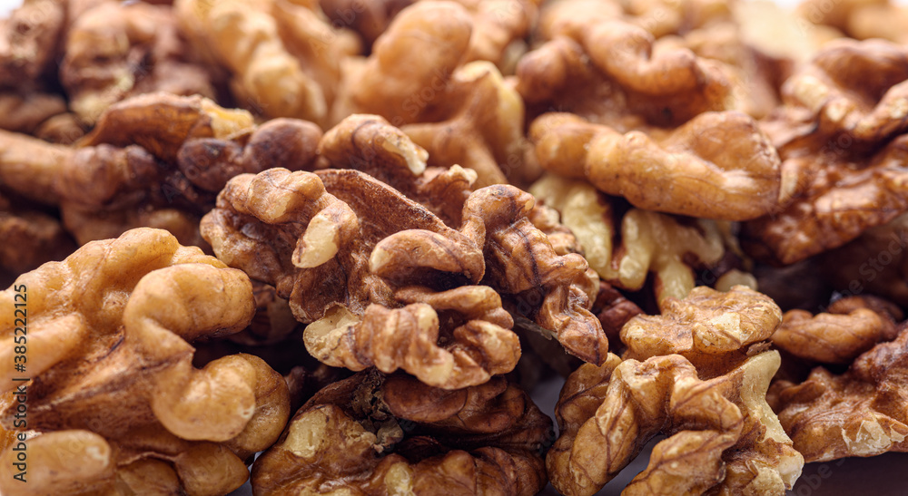 Peeled walnut kernels close-up, focus on foreground