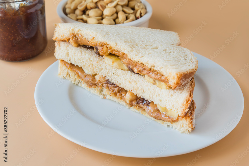 Peanut butter with bread and raspberry marmalade