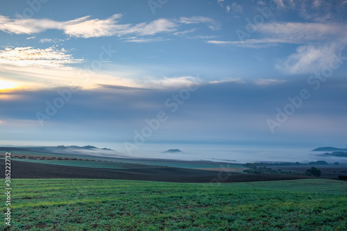 Landscape covered with fog in Central Bohemian Uplands, Czech Republic. photo