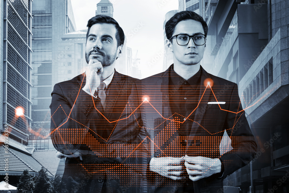Two entrepreneurs in suits pondering about new venture capital and hi-tech start up and try to forecast risks and estimate prospective earnings growth. Hologram chart on Singapore background. Two entrepreneurs in suits pondering about new venture capital and hi-tech start up and try to forecast risks and estimate prospective earnings growth. Hologram chart on Singapore background.