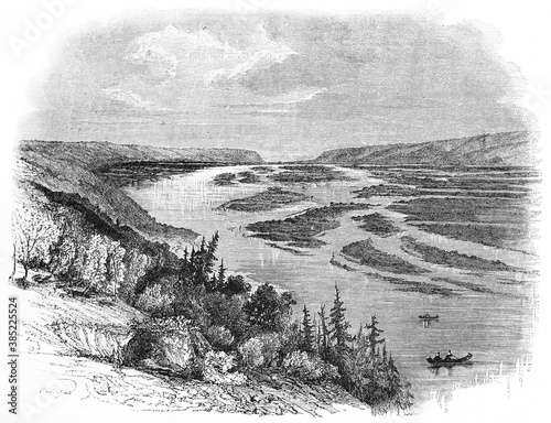 Large landscape lost on the horizon of Prairie du Chien, USA. River, shores and vegetation. Ancient grey tone etching style art by Huet, published on Le Tour du Monde, Paris, 1861