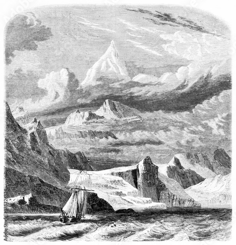 Monte Sarmiento in the Land of Fire, Chile, towering far in the distance on the sourrounding landscape. Ancient grey tone etching style art by Erhard and Bonaparte, Le Tour du Monde, Paris, 1861 photo