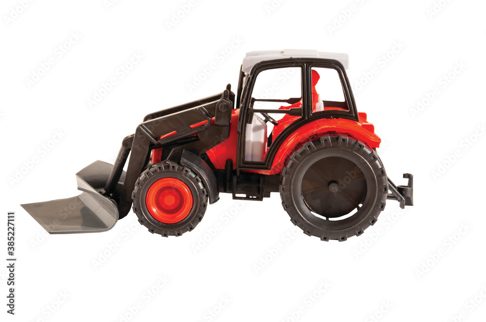 Naklejka premium toy tractor ON A WHITE BACKGROUND, HORIZONTAL ORIENTATION, ISOLATED