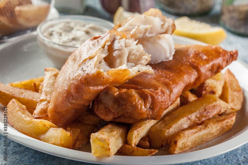 Fish in beer batter and chips with green pea and tartar sauce Fish in beer batter and chips with green pea and tartar sauce