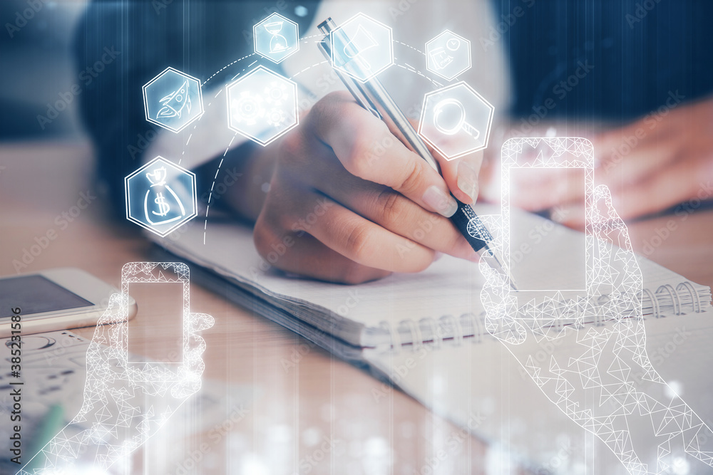 Technology theme hologram over woman's hands taking notes background. Concept of Tech. Double exposure Technology theme hologram over woman's hands taking notes background. Concept of Tech. Double exposure