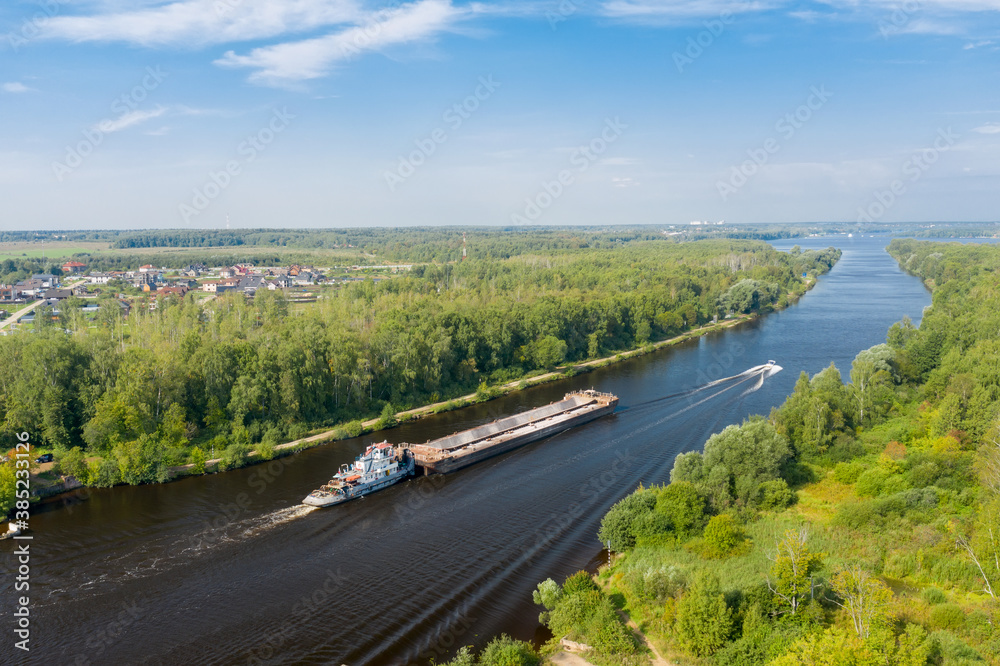 Top view of a water channel and a moving barge