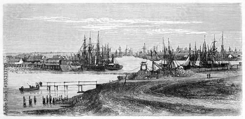 Horizontal oriented illustration of Melbourne sea port, Australia, full of docked ships. Ancient grey tone etching style art by Lancelot, Le Tour du Monde, Paris, 1861