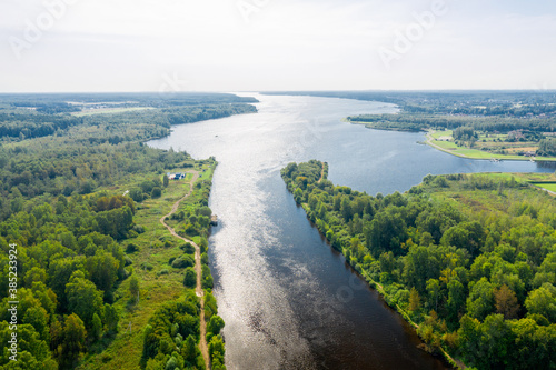 Top view of a water canal and reservoir on a summer evening