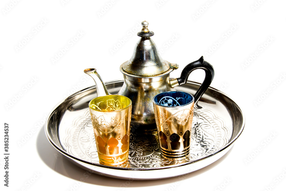 Group of teapot and glasses of oriental tea on a tray on white background Group of teapot and glasses of oriental tea on a tray on white background