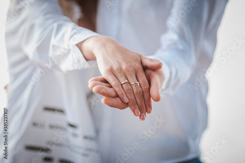 hands of newlyweds with wedding rings