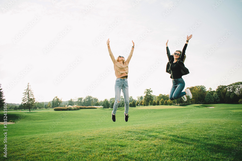 Happy young women on green meadow Happy young women on green meadow