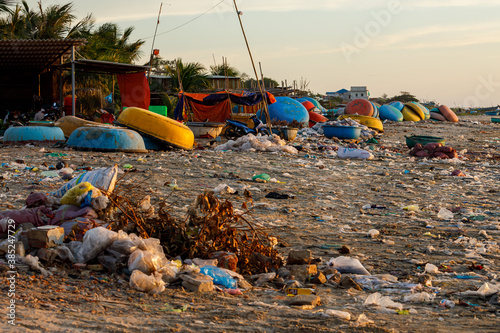 Plastic garbage on a beach at Mui Ne in Vietnam photo