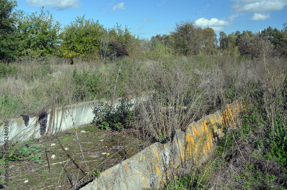 Broken concrete.Abandoned huge Soviet milk farm remains. Kiev Region