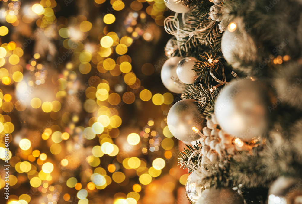 Christmas decoration in a golden style with bokeh and copy space. Merry Christmas and Happy Holidays.
Christmas decoration in a golden style with bokeh and copy space. Merry Christmas and Happy Holidays.