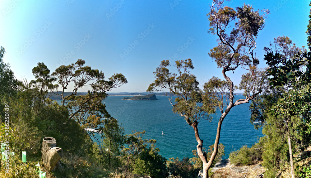 Beautiful afternoon view of ocean, island and deep blue sky from top of a lookout, West Head Lookout, Ku-ring-gai Chase National Park, Sydney, New South Wales, Australia
