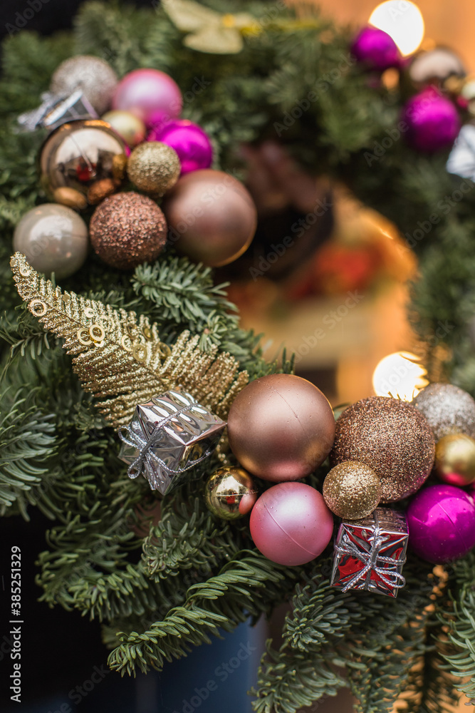 Christmas bouquet. Red flower of carnation, cone and cotton with Christmas tree branches. New year bouquet flowers and fir branches in a basket. Christmas wreath Christmas bouquet. Red flower of carnation, cone and cotton with Christmas tree branches. New year bouquet flowers and fir branches in a basket. Christmas wreath
