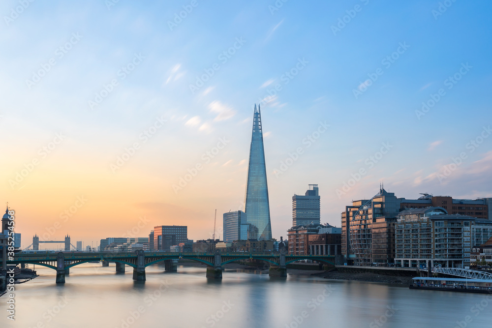 London skyline view from Thames river united kingdom at the sunrise 