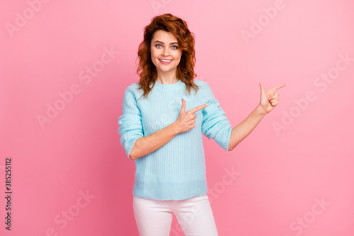Portrait of her she nice-looking attractive lovely confident glad cheerful cheery wavy-haired girl demonstrating empty blank space place solution isolated over pink pastel color background © deagreez