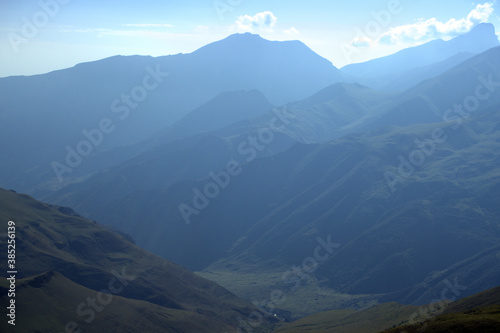 Alpine landscape with mountain peaks and green valleys. Caucasus, Russia.  © Anna