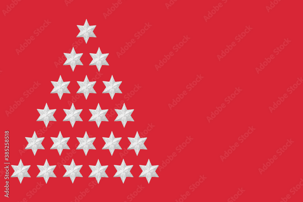 Abstract silver star Christmas tree concept on red background. Festive minimal design for the xmas holiday season. Abstract silver star Christmas tree concept on red background. Festive minimal design for the xmas holiday season.