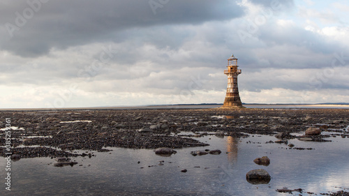 Fotografia Whiteford Lighthouse is listed by Cadw as Grade II* A wave-swept cast-iron lighthouse in British coastal waters and an important work of cast-iron engineering and nineteenth-century architecture