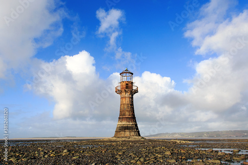 Fototapeta Whiteford Lighthouse is listed by Cadw as Grade II* A wave-swept cast-iron lighthouse in British coastal waters and an important work of cast-iron engineering and nineteenth-century architecture