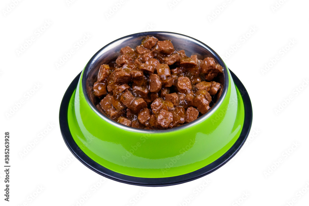 Canned food for cats or dogs in metal green bowl isolated on white background Canned food for cats or dogs in metal green bowl isolated on white background