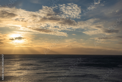 Stormy skies over the sea with varying colours and cloud formations