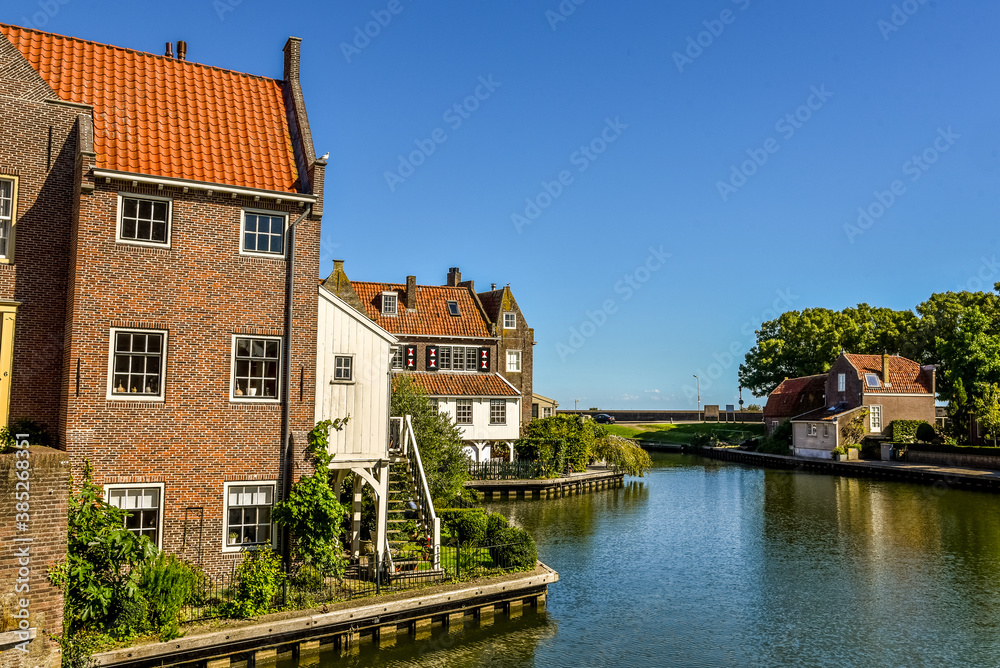 Old houses with historic facades near the harbor of Enkhuizen, the Netherlands.