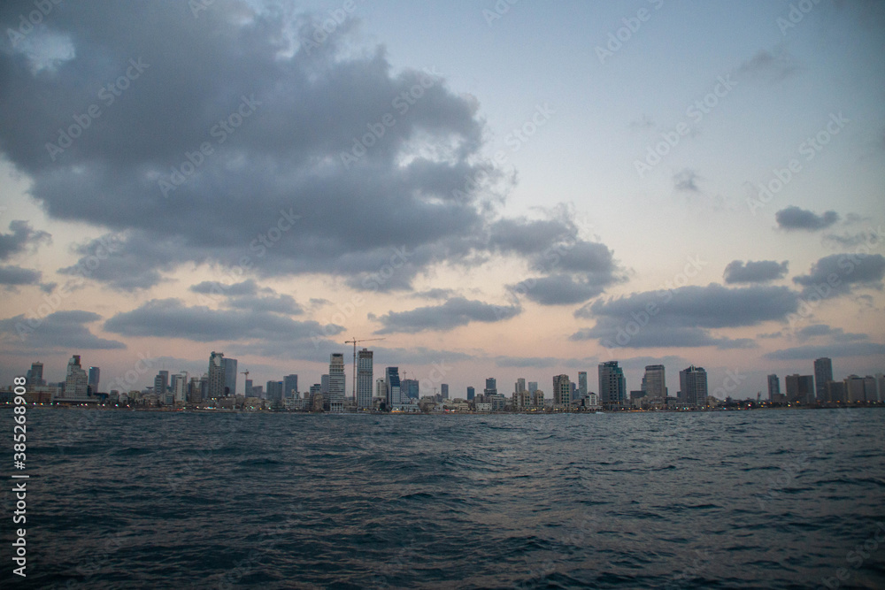 View at Tel Aviv buildings from the sea at twilight View at Tel Aviv buildings from the sea at twilight