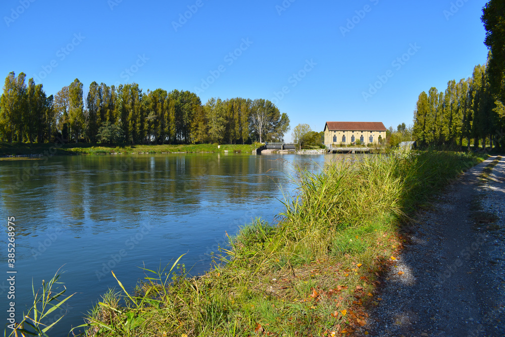 view of a countryside landscape with river and wild nature view of a countryside landscape with river and wild nature