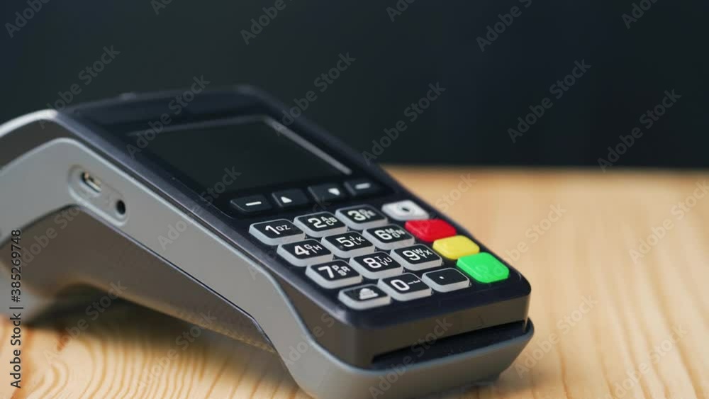Contactless payment with smartphone. Wireless payment concept. Close-up, woman using smartphone cashless wallet NFC technology to pay order on bank terminal. Contactless payment with smartphone. Wireless payment concept. Close-up, woman using smartphone cashless wallet NFC technology to pay order on bank terminal.