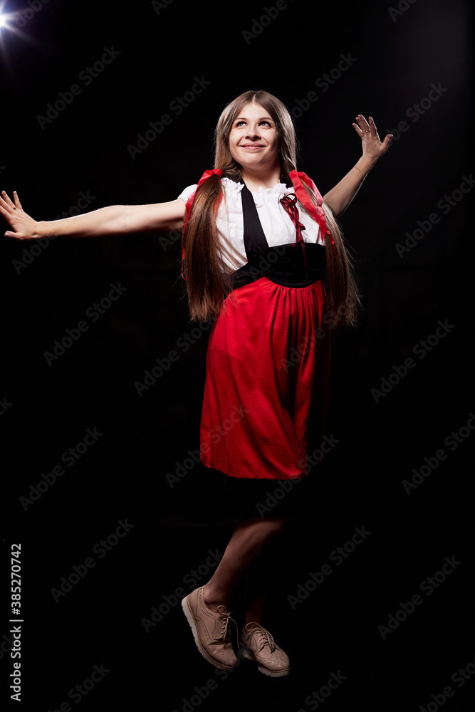 Girl in ethnic dress posing in dark studio Girl in ethnic dress posing in dark studio