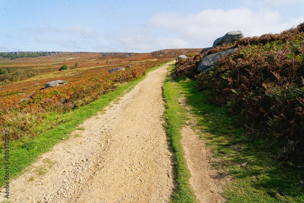 Sandstone path leads up across Burbage Moor on an autumn morning