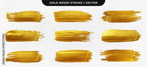 Golden paint brush stroke. Set of gold paint smear with glittering texture. Realistic gold brush stroke with metallic effect