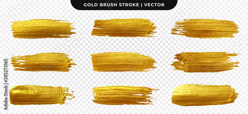 Golden paint brush stroke. Set of gold paint smear with glittering texture. Realistic gold brush stroke with metallic effect