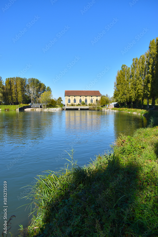 Obraz premium view of a countryside landscape with river and wild nature
