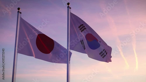 Japan and South Korea flags on a pole showing cooperation between Seoul and Tokyo. International friendship and diplomacy from japanese and koreans.
