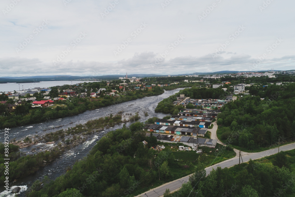 Fototapeta premium Aerial Townscape of Suburb of the Town Kandalaksha located in Northwestern Russia