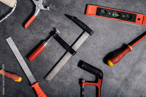 Tools lying on the concrete background, flat lay, top view