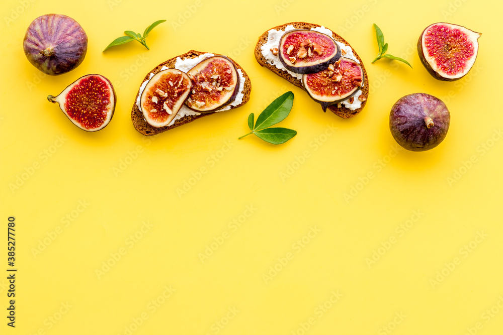 Toasted bread with figs, cheese and honey on table Toasted bread with figs, cheese and honey on table