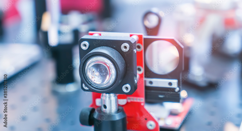 Experiment with laser device in optical laboratory Experiment with laser device in optical laboratory