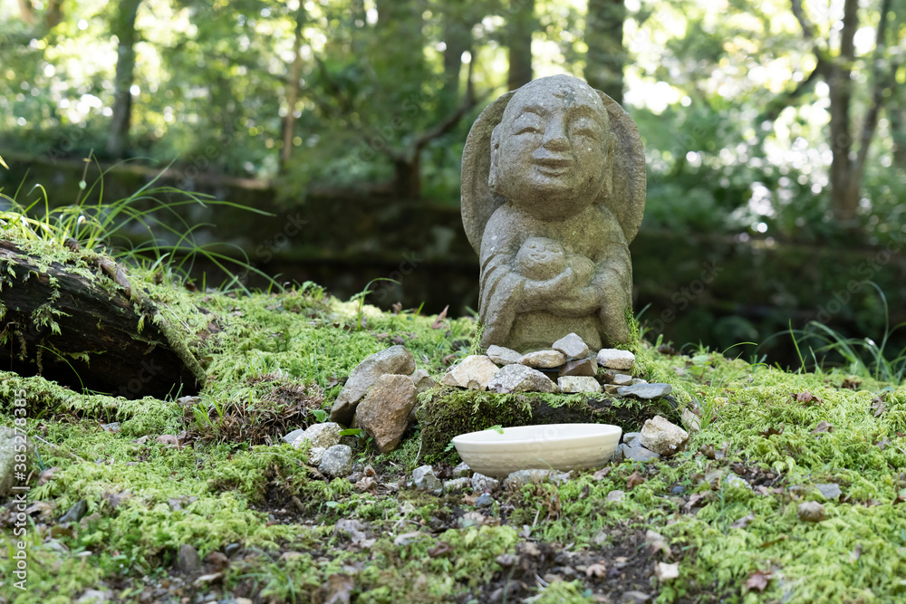 A small stone-built Jizo in a Japanese garden