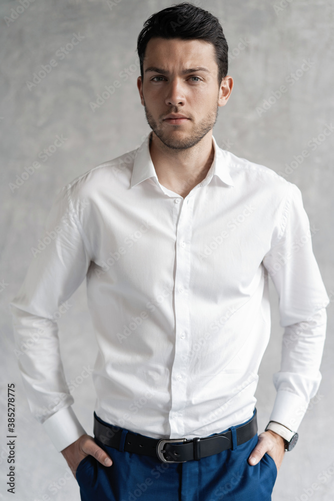 Handsome man wear blue suit isolated on grey background Handsome man wear blue suit isolated on grey background