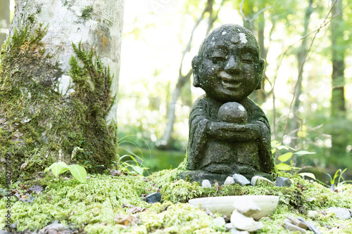 A small stone-built Jizo in a Japanese garden