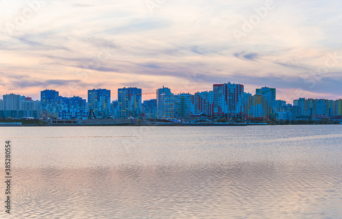 Beautiful view of modern city. Modern buildings near the water on sunset